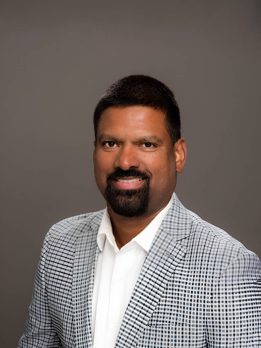Vijay Bhuse smiling for a professional photo
